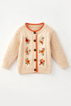 Cream cable knit cardigan with embroidered flowers. TPG60611 AMY