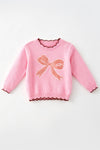 Lt. Pink knit sweater with bow applique and moon stitch trim. TPG60757 MON