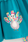 Teal tunic w/ turkey applique and floral bell bottoms. OFG61938 MON