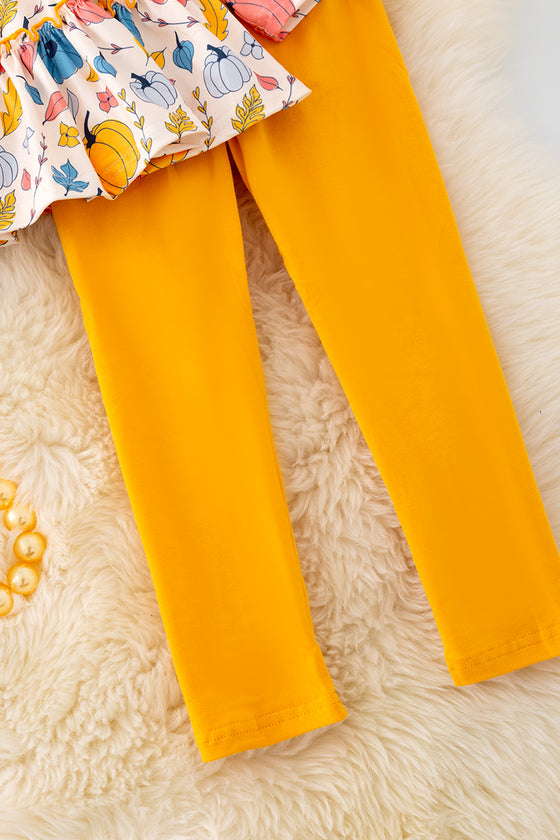 OFG42046 LOI: Pumpkin printed ruffle tunic & mustard leggings.