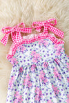 Purple/pink floral tunic with gingham straps and blue shorts. OFG53421 SOL