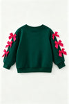 Green and Merry Christmas application top with fuchsia bows on sleeves. TPG60718 MON