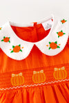 Orange smocked dress with embroidered pumpkin. DRG64521 AMY
