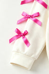 Feeling Extra Grin-mas white top with pink bows. TPG60687 Mon