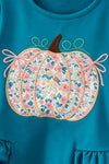 Teal tunic with pumpkin applique and floral leggings. OFG63393 SOL