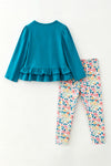 Teal tunic with pumpkin applique and floral leggings. OFG63393 SOL