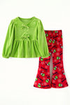 Green faux velvety tunic and red pants. OFG63380 MON