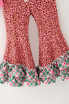Santa printed on pink long sleeve top and animal printed bottoms w/green ruffle plaid. OFG62999 MON