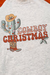 "Cowboy Christmas" Ivory raglan with burnt brown sleeves & cactus print. TPB50143013 Jeann