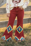 Aztec on burnt orange printed denim pants. PNG65153060-SOL