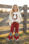 Aztec on burnt orange printed denim pants. PNG65153060-SOL