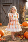 Scarecrow applique dress with embroidered hem. DRG41559 SOL
