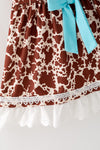 Brown cow printed dress with lace hem and front bow. DRG64467 AMY