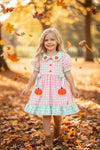 Pink & mint gingham dress with ruffle hem and side bows. DRG64502 MON