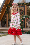 Christmas character on lt. pink dress with red ruffle hem. DRG65528 SOL