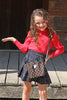 RED TURTLE NECK WITH PUFFY SHOULDER TOP & BLACK PLEATED SKIRT. OFG651322038-AMY