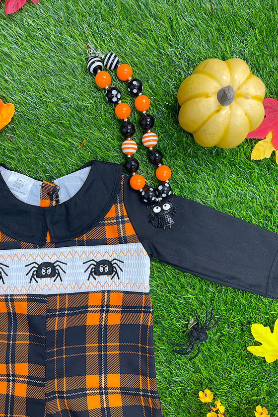 🔶SMOCKED BABY ROMPER WITH SPIDER EMBROIDERY. c