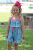 Howdy turquoise romper with fuchsia trim and ruffle hem. PNG50208 JEAN