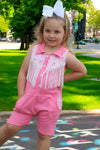 Pink Romper with side pockets and fringe.