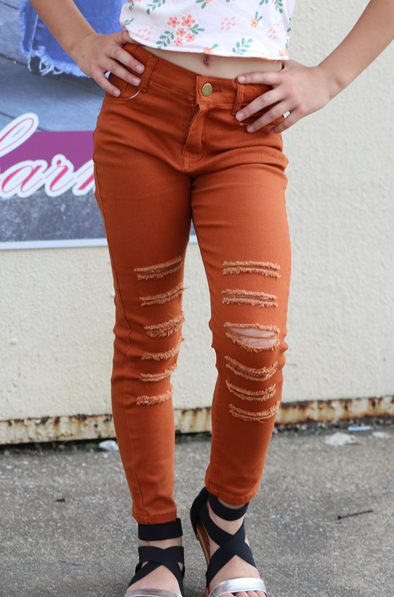 Rust ripped skinny jeans. PNG25133062-sol