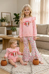 Cow applique on pink sweatshirt with floral bell bottoms. OFG61399 AMY