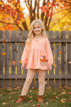 Lt. Coral tunic with pumpkin applique and floral leggings. OFG61931 SOL