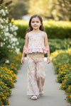 A playful floral tunic with a ruffled hem, adorned with side bows and bottoms. OFG62051 SOL