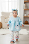 Lt. Blue gingham tunic with pumpkin applique and floral leggings. OFG62654 AMY