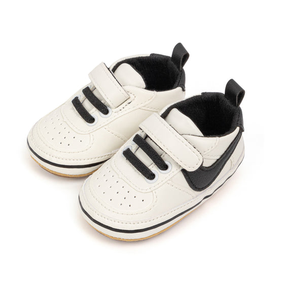 Off white infant tennis shoes with velcro. PT5111N