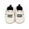 Off white infant tennis shoes with velcro. PT5111N