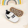 Off white infant tennis shoes with velcro. PT5111N