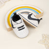 Off white infant tennis shoes with velcro. PT5111N