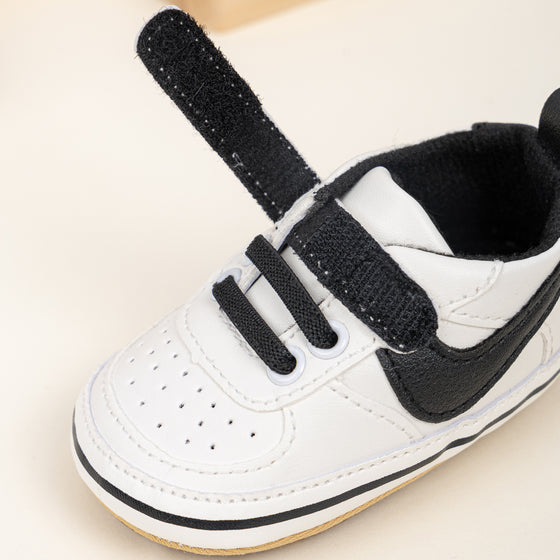 Off white infant tennis shoes with velcro. PT5111N