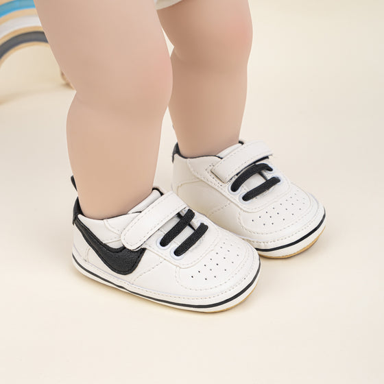 Off white infant tennis shoes with velcro. PT5111N