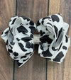 BLACK & WHITE COW SPOT PRINTED HAIR BOW. 7.5" WIDE 4PCS/$10.00 BW-DSG-99