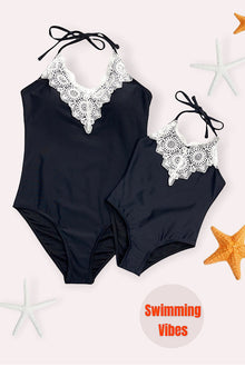  GIRLS/ BLACK HALTER SWIMSUIT WITH EMBROIDERED DETAIL. XH-982145-JEANN