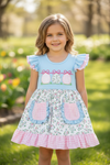 Lt.Blue floral printed dress with ruffle hem & egg applique. DRG60271 SOL