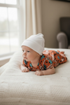 Cute bull skull burnt orange printed baby gown. PJB25153009