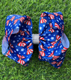 Red stripe bow on royal blue with white star printed. BW-DSG-5124