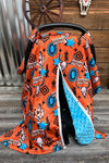 Orange howdy cow skull printed canopy cover. 