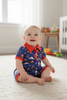 Navy blue western printed baby romper w/ red trim. SR121102-JEAN