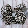 6.5"Lt. Tan Leopard Character printed hair bows. 4pcs/$10.00. BW-DSG-5079