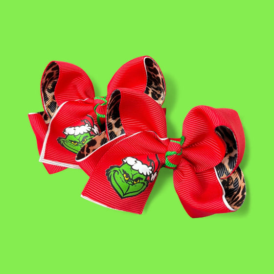 3" Christmas character double ribbon hair bows. Available in 2 colors! 12pcs/16.50