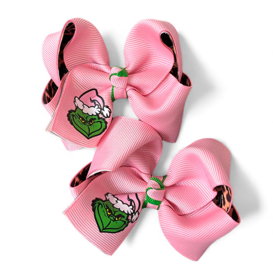 3" Christmas character double ribbon hair bows. Available in 2 colors! 12pcs/16.50