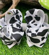 BLACK & WHITE COW SPOT PRINTED HAIR BOW. 7.5" WIDE 4PCS/$10.00 BW-DSG-99