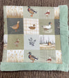 32 inch x 32 inch multi printed duck baby blanket with mint faux fur.