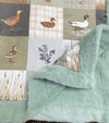 32 inch x 32 inch multi printed duck baby blanket with mint faux fur.
