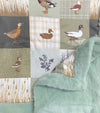 32 inch x 32 inch multi printed duck baby blanket with mint faux fur.