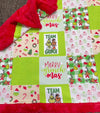 32 inch X 32 inch Green & red Christmas printed baby blanket.