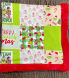 32 inch X 32 inch Green & red Christmas printed baby blanket.